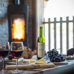 Wine and cheese by a roaring fire
